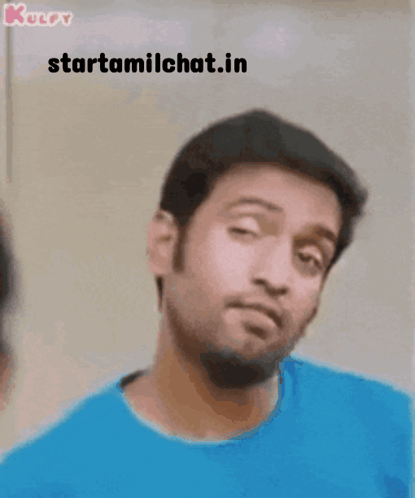 Man In Blue Shirt Making Funny Face With Starttamilchat.in GIF