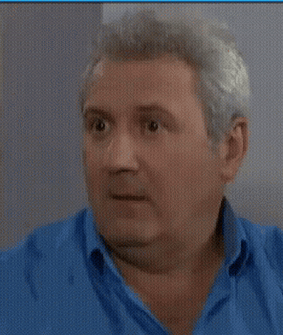 Man In Blue Shirt Making Funny Face GIF