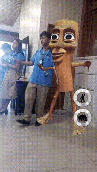 Man In Blue Shirt Next To Cartoon Character With Fist On Floor GIF