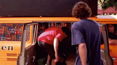 Man In Blue Shirt Next To Orange Van Saying En GIF