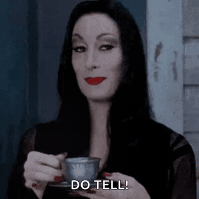 Man In Blue Shirt Next To Woman In Brown Dress GIF