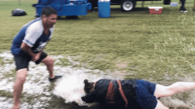 Man In Blue Shirt Next To Woman In Muddy Field GIF