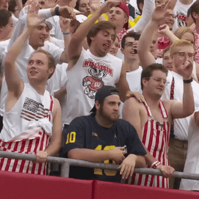 Man In Blue Shirt Number 10 In Crowd GIF