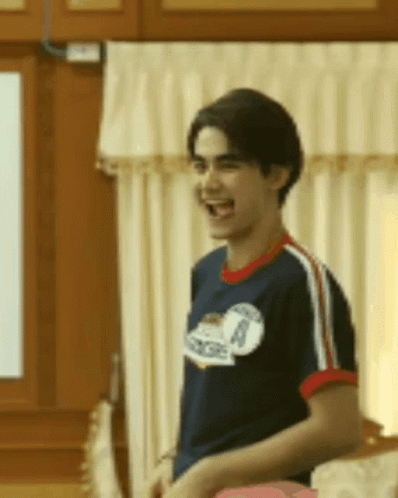Man In Blue Shirt Number 8 Laughing GIF