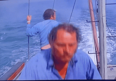 Man In Blue Shirt On Boat GIF