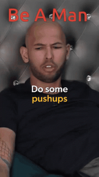 Man In Blue Shirt On Soccer Field With Reach For The Sky Sign GIF