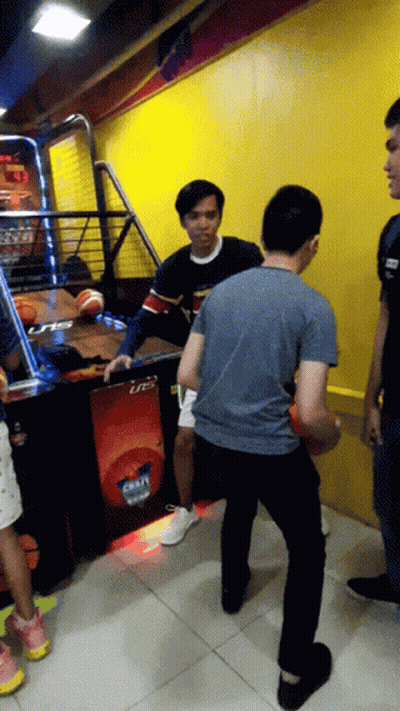 Man In Blue Shirt Playing Basketball With Machine Saying Lrts GIF