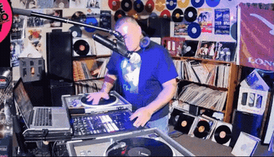 Man In Blue Shirt Playing Music At Mic Saying Long GIF
