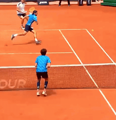 Man In Blue Shirt Playing Tennis GIF