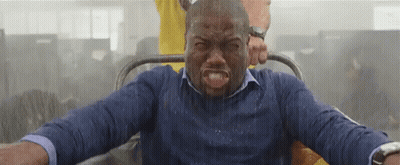 Man in Blue Shirt Riding Roller Coaster