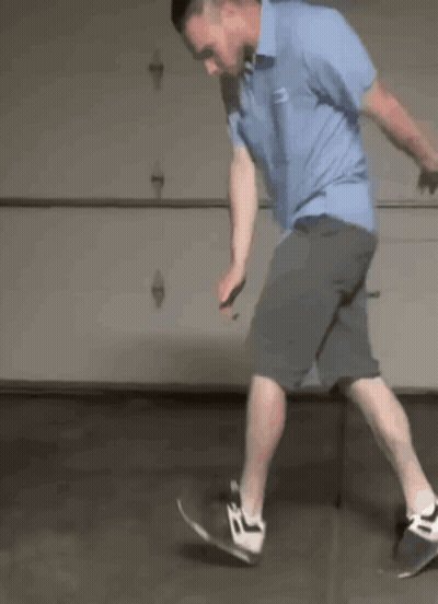 Man In Blue Shirt Riding Skateboard GIF