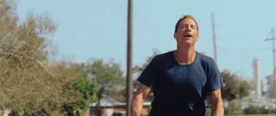 Man In Blue Shirt Running Eyes Closed GIF