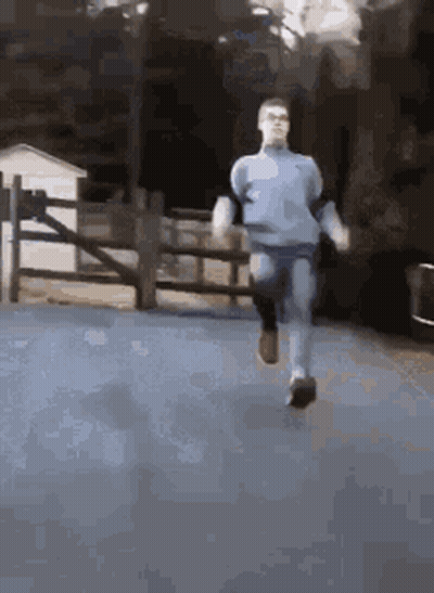 Man In Blue Shirt Running GIF