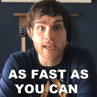 Man In Blue Shirt Saying As Fast As You Can GIF
