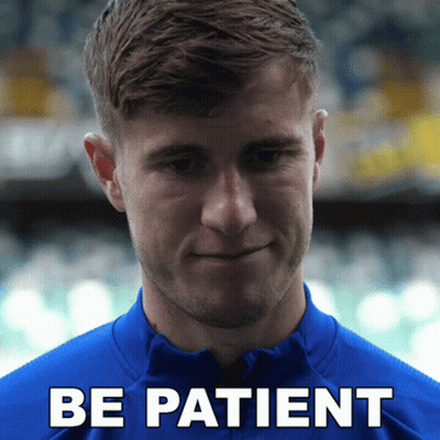Man In Blue Shirt Saying Be Patient GIF
