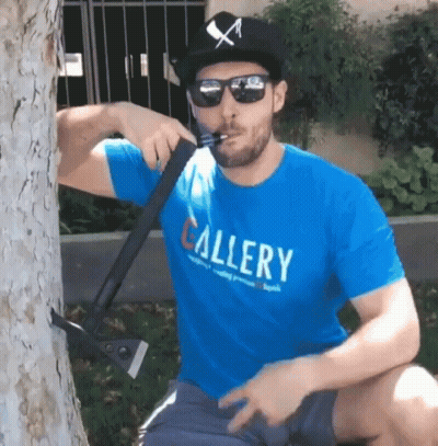 Man In Blue Shirt Saying Gallery Smoking Cigarette GIF