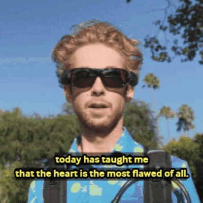 Man In Blue Shirt Saying Heart Is Most Flawed GIF