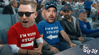 Man In Blue Shirt Saying I'm With Stupid GIF