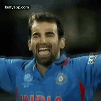 Man In Blue Shirt Saying India Making Funny Face GIF