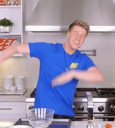 Man in Blue Shirt Saying Jet Dancing in Kitchen