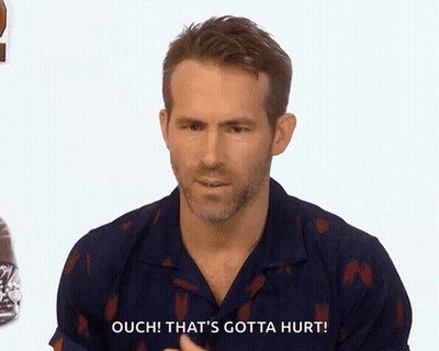 Man In Blue Shirt Says Ouch GIF
