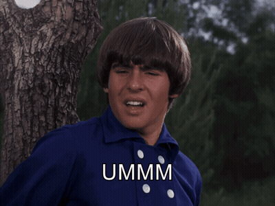 Man In Blue Shirt Says Ummm Beside Tree GIF