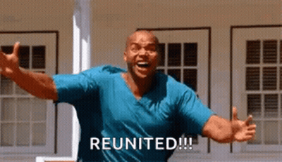 Man In Blue Shirt Shouting With Arms Outstretched GIF