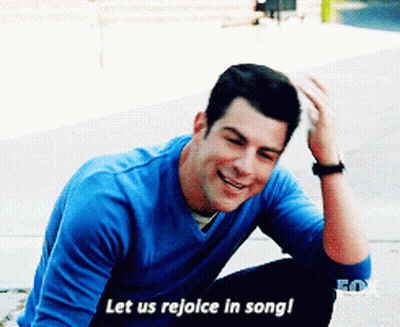 Man In Blue Shirt Singing And Smiling GIF