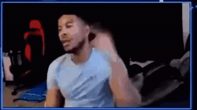Man In Blue Shirt Sitting At Computer GIF