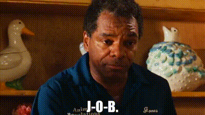 Man In Blue Shirt Sitting By Shelf With Duck And Chicken GIF