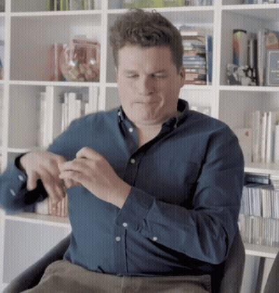 Man In Blue Shirt Sitting Eyes Closed GIF