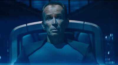 Man In Blue Shirt Sitting Eyes Closed Saying Well GIF