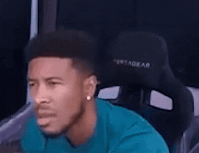 Man In Blue Shirt Sitting In Black Chair GIF