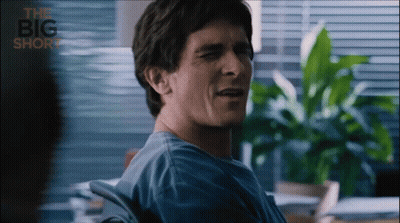 Man In Blue Shirt Sitting In Chair Saying Big Short GIF