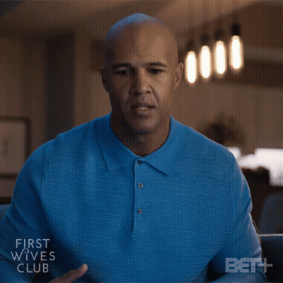 Man In Blue Shirt Sitting In Front Of First Wives Club Screen GIF