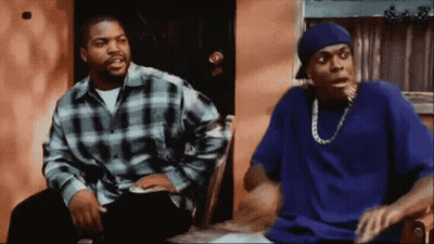 Man In Blue Shirt Sitting Next To Man In Plaid GIF