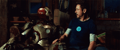 Man In Blue Shirt Sitting Next To Man In Suit GIF