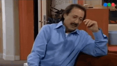 Man in Blue Shirt Sitting on Couch