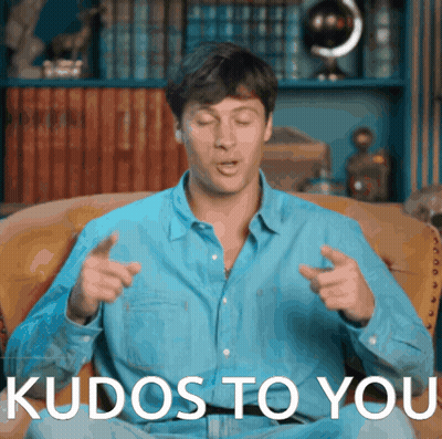 Man in Blue Shirt Sitting on Couch With Kudos to You