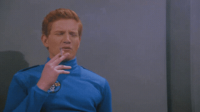 Man In Blue Shirt Smelling Germany GIF