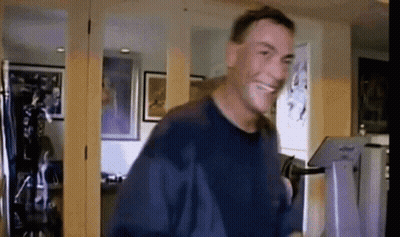 Man In Blue Shirt Smiling And Dancing GIF