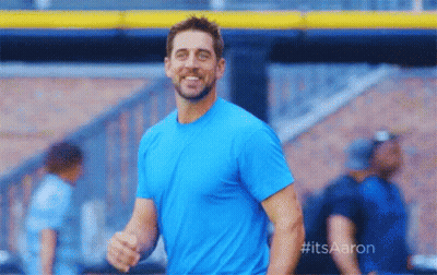 Man In Blue Shirt Smiling At Baseball Stadium GIF
