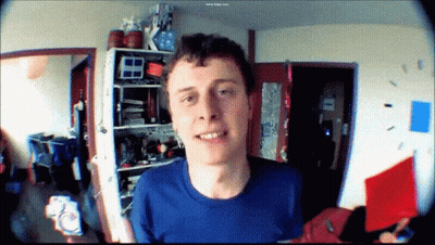 Man In Blue Shirt Smiling At Camera GIF