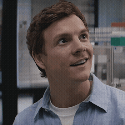 Man In Blue Shirt Smiling In Laboratory GIF