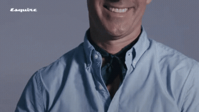 Man In Blue Shirt Smiling With Esquire Logo GIF