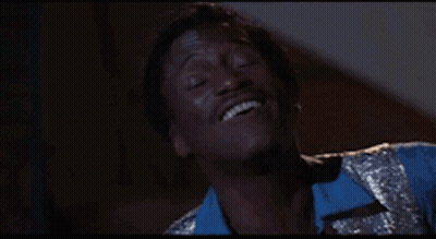 Man In Blue Shirt Smiling With Eyes Closed GIF