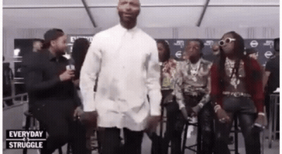 Man In Blue Shirt Smiling With Ponytail GIF