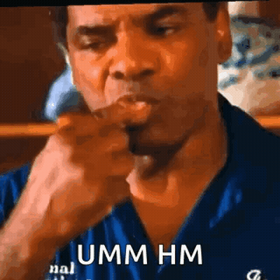 Man In Blue Shirt Smoking And Pointing GIF