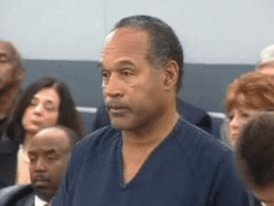 Man In Blue Shirt Standing Before Crowd GIF