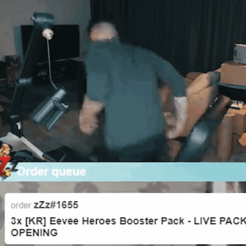 Man In Blue Shirt Standing In Front Of Order Queue Sign GIF